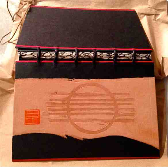 The Grafik Guitar artist book, cover and stitching, bookbinding design by Imogen Yang. (Photo-© 2013 Michael Hill).